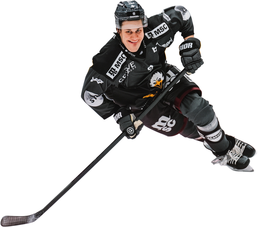 Jesse Puljujärvi luistelee kiekon kanssa Genève-Servetten pelipaidassa